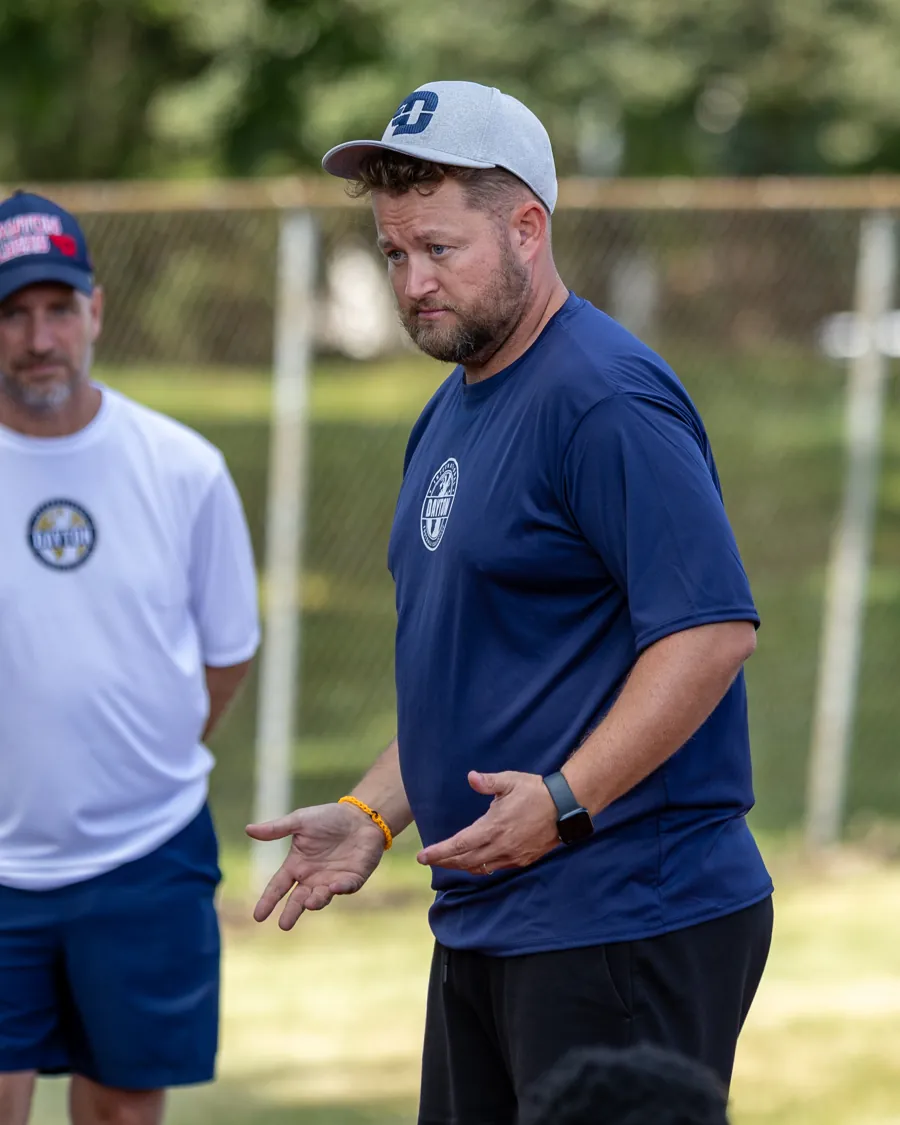 An IFC Dayton coach giving instructions at the field