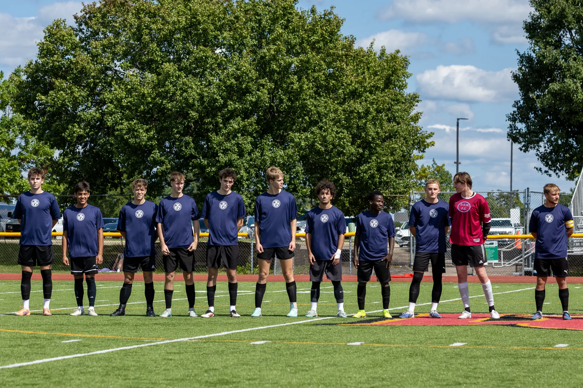 IFC Dayton players lined up on the soccer field