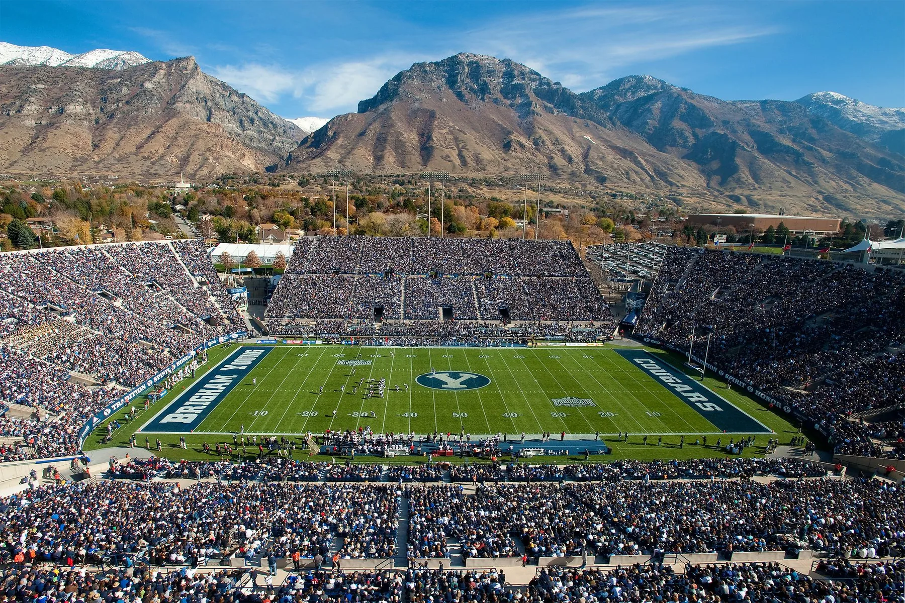 American college stadium surrounded by mountains
