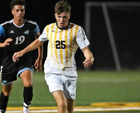 Roy Parkyn driving forward with the ball