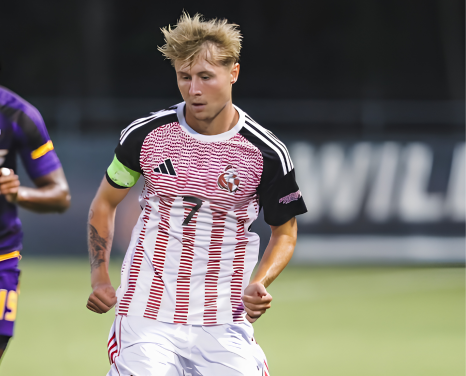 Rico Duggan on the ball wearing the captain's armband